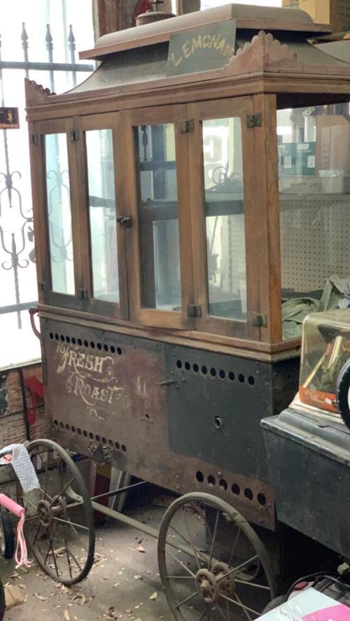 Vintage wooden cart with glass windows, labeled "Fresh & Roasted," used for selling lemonade.