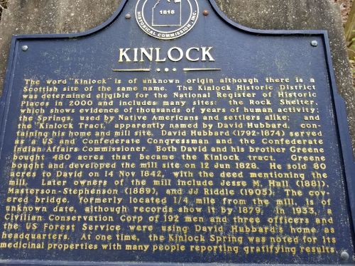 Historical marker for Kinlock, detailing its origins and notable figures from 1818 to 1935.