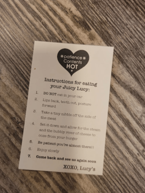 Instructions card for eating a Juicy Lucy burger, with tips on posture, patience, and enjoying the meal.