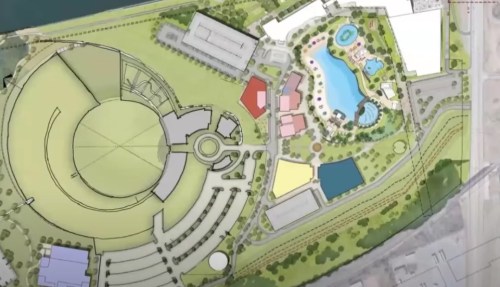 Aerial layout of a recreational area featuring a pool, gardens, and various buildings, including an amphitheater.
