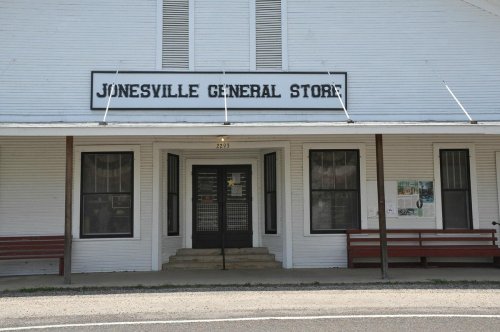 Front view of the Jonesville General Store, featuring a white facade and a sign above the entrance.