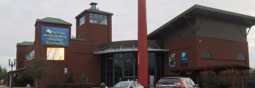 Exterior view of the National Mississippi River Museum and Aquarium, featuring brick architecture and signage.