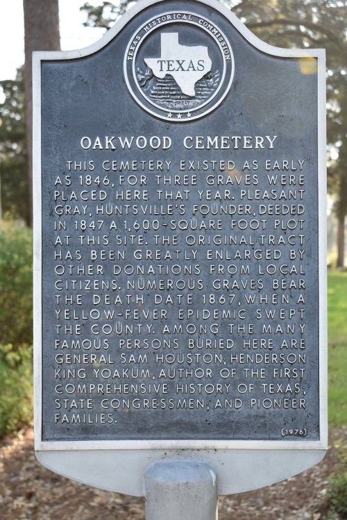 Sign at Oakwood Cemetery, noting its history since 1846 and mentioning notable burials and local contributions.