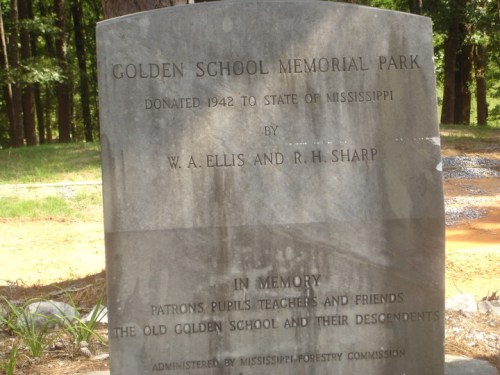 A stone memorial plaque honoring Golden School Memorial Park, donated in 1942, with names of contributors and a dedication.