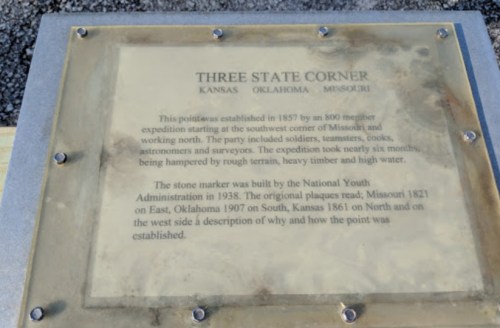 A plaque detailing the history of the Three State Corner, marking Kansas, Oklahoma, and Missouri's boundaries.