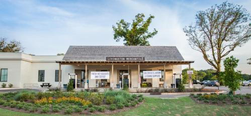 Exterior of Livingston Mercantile, featuring a welcoming entrance and landscaped garden.