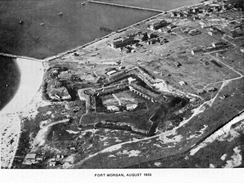 Aerial view of Fort Morgan, August 1933, showcasing the fort's structure and surrounding landscape.