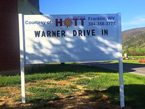 Sign for Warner Drive-In in Franklin, WV, sponsored by HOTT Insurance, with a phone number listed.