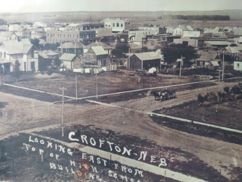 Historic view of Crofton, Nebraska, looking east from the top of a school building, featuring early 20th-century architecture.