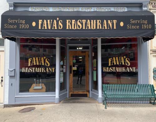 Front view of Fava's Restaurant, featuring a black awning with gold lettering and a welcoming entrance.