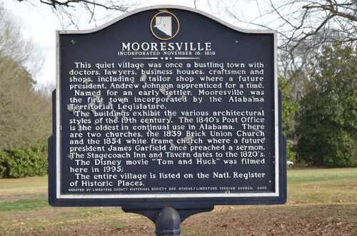 Historic sign about Mooresville, Alabama, detailing its architectural styles and historical significance.