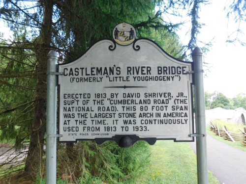 Sign for Castleman's River Bridge, detailing its history and significance as a stone arch bridge built in 1813.