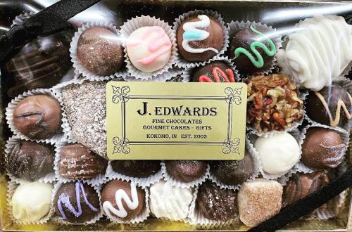 A box of assorted gourmet chocolates with a label reading "J. Edwards Fine Chocolates, Kokomo, IN, Est. 2003."