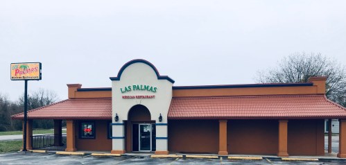 Exterior of Las Palmas Mexican Restaurant, featuring a colorful sign and a warm, inviting facade.