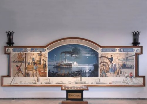 A mural depicting scenes of music, dance, and theater, featuring a steamboat and historical activities.