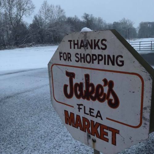 Sign for Jake's Flea Market, with a snowy landscape in the background. Text reads, "Thanks for shopping."