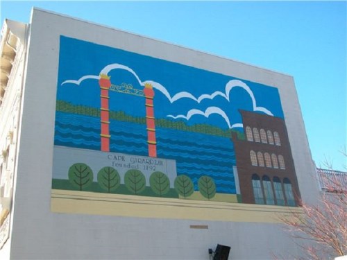 Colorful mural depicting a river, trees, and buildings with the text "Cape Girardeau, founded 1792" on a wall.