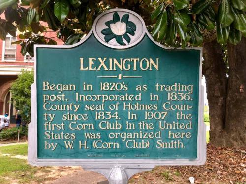 Historical marker for Lexington, detailing its founding, incorporation, and the establishment of the first Corn Club in 1907.