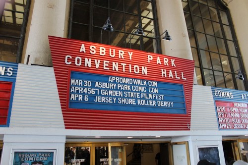 Signboard at Asbury Park Convention Hall displaying upcoming events and dates.