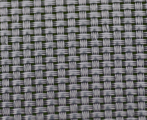 Close-up of a woven fabric pattern featuring alternating white and dark threads in a grid-like design.