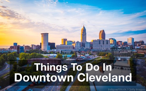 A scenic view of downtown Cleveland with skyscrapers and a river at sunset, featuring the text "Things To Do In Downtown Cleveland."