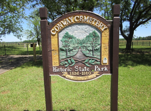 Sign for Conway Cemetery, Historic State Park, featuring trees and a pathway, established 1836-1840.