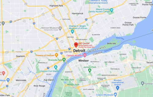 Map showing Detroit, Michigan, with nearby landmarks and the border to Windsor, Canada.