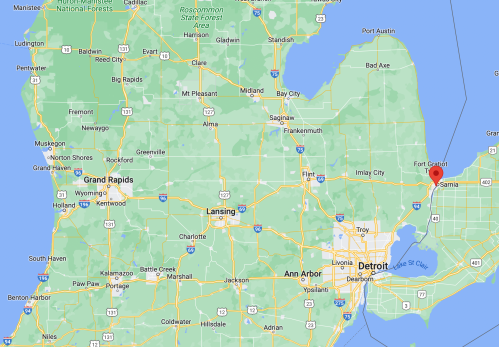 Map of Michigan showing major cities like Detroit, Grand Rapids, and Ann Arbor, with a focus on the northeastern region.