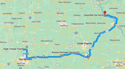 Map showing a route from Des Moines to Cassville Car Ferry, passing through Cedar Rapids and Amana Heritage Society.