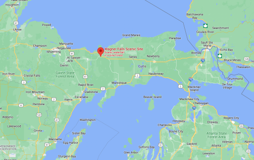 Map showing Wagner Falls Scenic Site in Michigan, surrounded by lakes and forests.