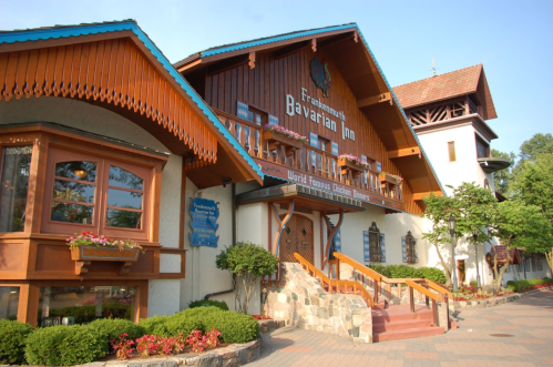 Exterior view of the Frankenmuth Bavarian Inn, featuring traditional Bavarian architecture and lush greenery.