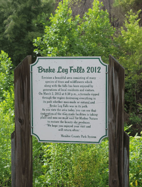 Sign for Broke Leg Falls 2012, describing the area's natural beauty and the impact of a tornado on the landscape.