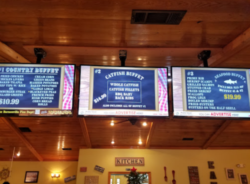 Three menu boards display buffet options: Country Buffet, Catfish Buffet, and Seafood Buffet with prices.