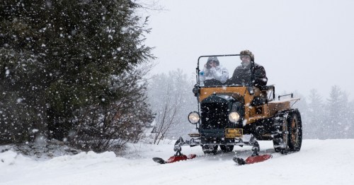 Beautiful shot of a snowmobile on the mountains of New Hampshire.