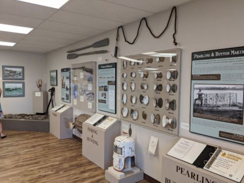 A museum exhibit featuring displays on pearling and fishing, with artifacts and informational panels on the walls.