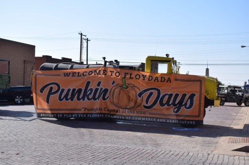 Banner for "Punkin Days" festival in Floydada, Texas, featuring a pumpkin and welcoming visitors to the event.