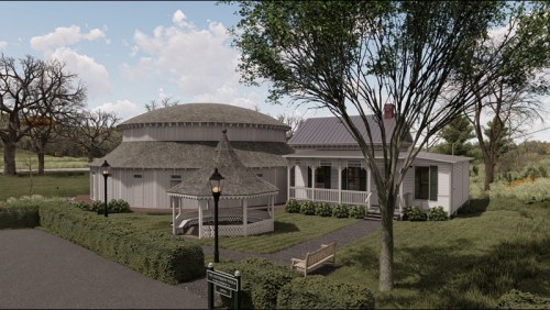 A scenic view of a round house with a thatched roof, surrounded by greenery and a gazebo in a peaceful setting.