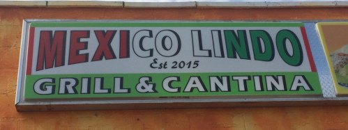 Sign for "Mexico Lindo Grill & Cantina," established in 2015, featuring vibrant red, green, and yellow colors.