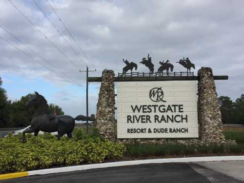 Sign for Westgate River Ranch Resort & Dude Ranch, featuring a horse sculpture and cowboy silhouettes.