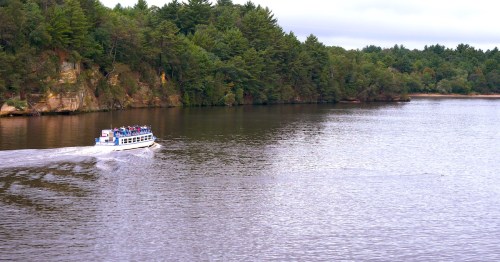 Cruising the scenic river, boat tour. Landscape, summertime, cloudy day. Wisconsin River, Wisconsin Dells.