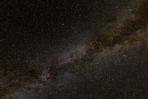 A stunning view of a starry night sky, featuring a bright Milky Way galaxy and countless twinkling stars.