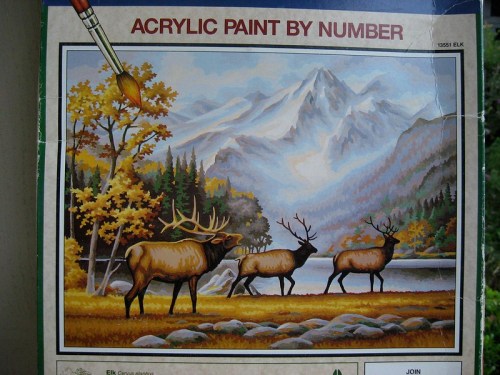 A paint-by-number kit featuring elk in a scenic landscape with mountains and autumn trees.