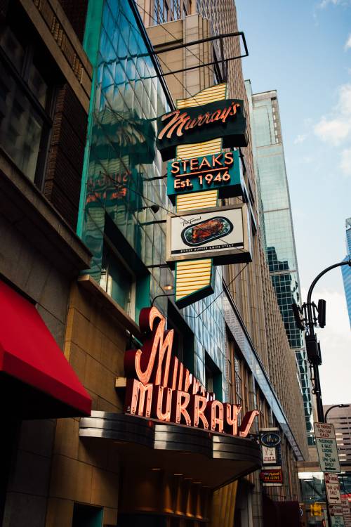 Signage for Murray's Steakhouse, established in 1946, displayed on a building in an urban setting.