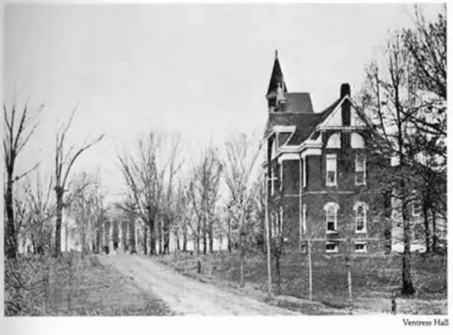 Historic black-and-white photo of Ventress Hall, a brick building surrounded by bare trees and a dirt path.