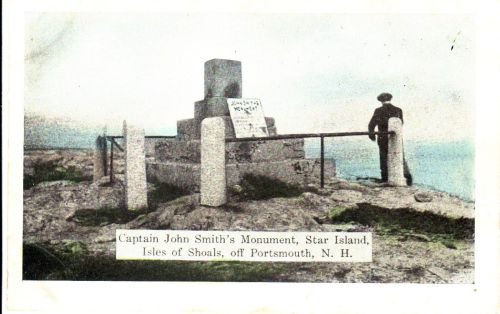 A man stands by Captain John Smith's Monument on Star Island, surrounded by rocky terrain and ocean views.