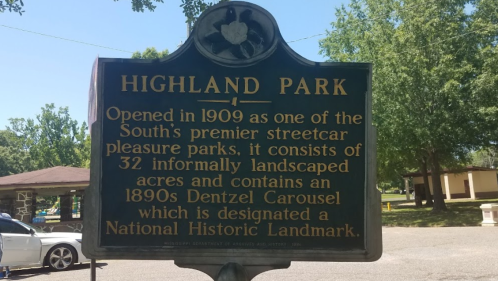 Sign for Highland Park, detailing its history as a streetcar pleasure park with a historic carousel.