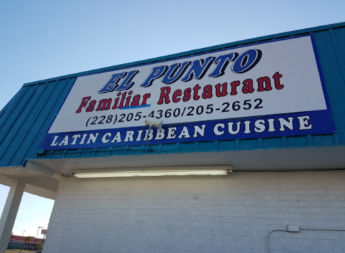 Sign for "El Punto Familiar Restaurant" featuring Latin Caribbean cuisine, with contact numbers displayed.