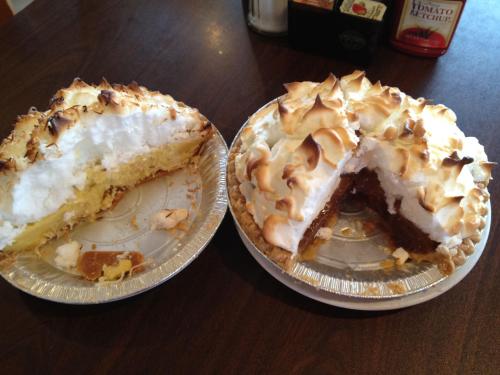Two pie dishes: one with a slice removed, showing a creamy filling, and the other topped with golden meringue.