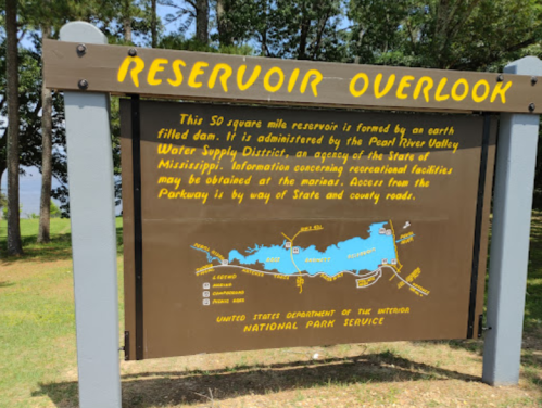 Sign at a reservoir overlook, detailing its features and management by the Pearl River Valley Water Supply District.
