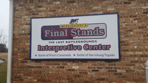 Sign for "Mississippi's Final Stands Interpretive Center," highlighting the Battle of Brice's Crossroads and Battle of Harrisburg/Tupelo.